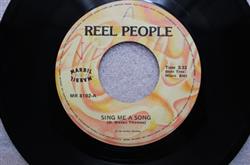 ouvir online Reel People - Sing Me A Song Hold It In The Road
